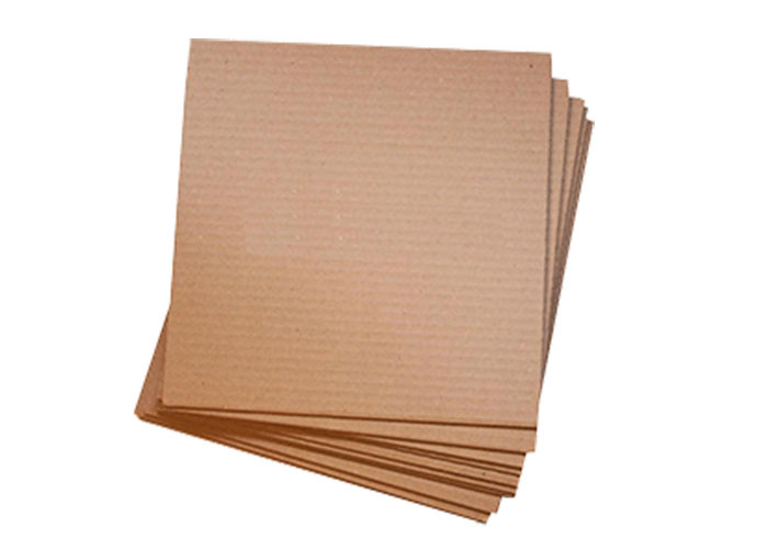 Flat sheets of brown corrugated cardboard used for padding and layering.