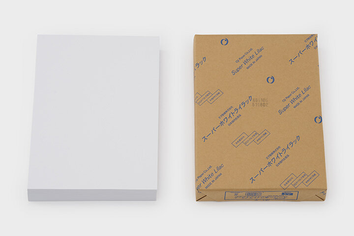 Samples of Oji Papers showing a variety of weights and high-whiteness finishes.