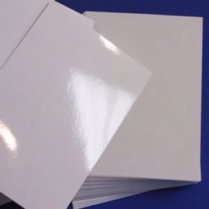 A stack of PE Gloss Offset synthetic paper with a high-shine finish.