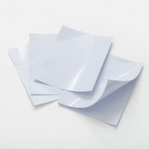 Standard Coated Gloss paper with a shiny finish, ideal for vibrant commercial printing.