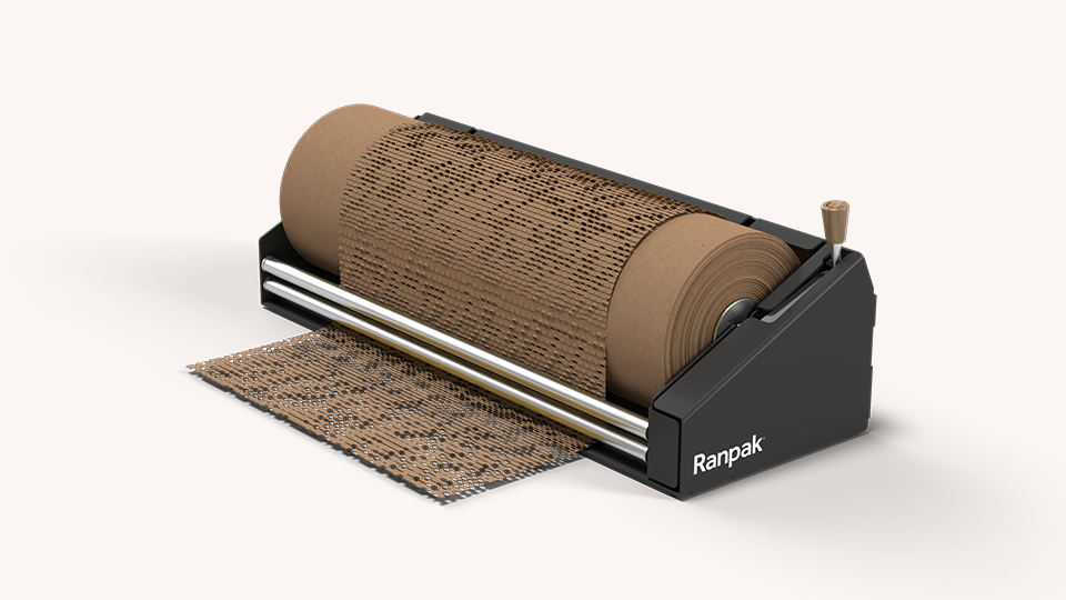 Wrap and Go manual protective packaging dispenser showing tension-stretched kraft wrapping paper.